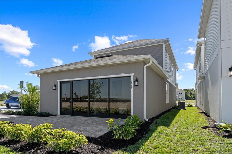 Exterior details and patio area of a home in Trinity Place, St. Cloud (Image 3).