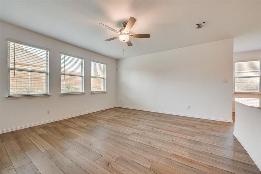 Spare room featuring light hardwood / wood-style floors and ceiling fan