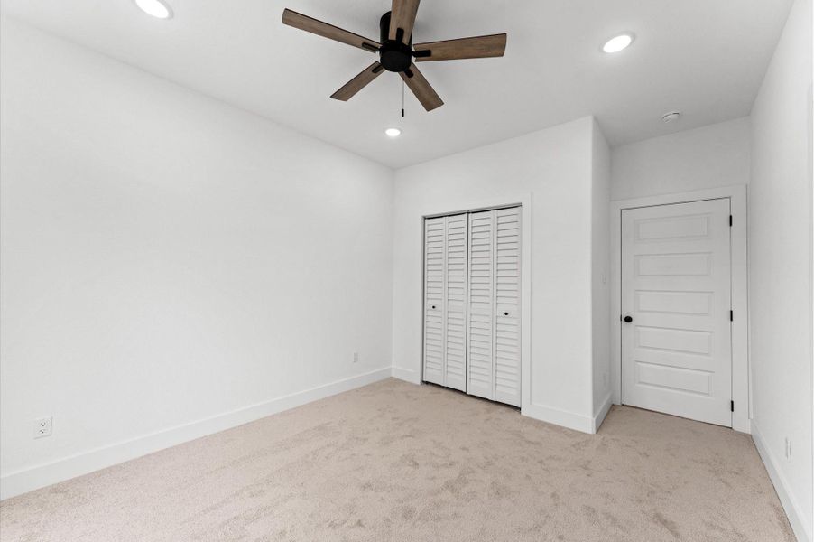 Like the other bedroom, Bedroom 3 offers a closet behind bifold doors.