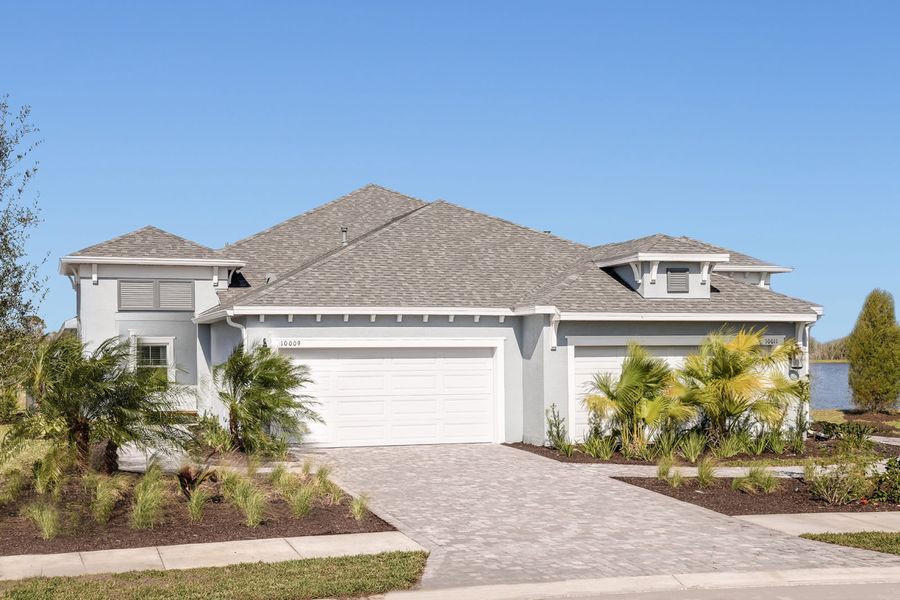 Representative exterior photo of a completed home built from the Crystal Sand 2 by Neal Communities in Wildleaf, Parrish, FL (Image 20). Representative exterior photo of a completed home built from the Crystal Sand 2 by Neal Communities in Wildleaf, Parrish, FL (Image 20).