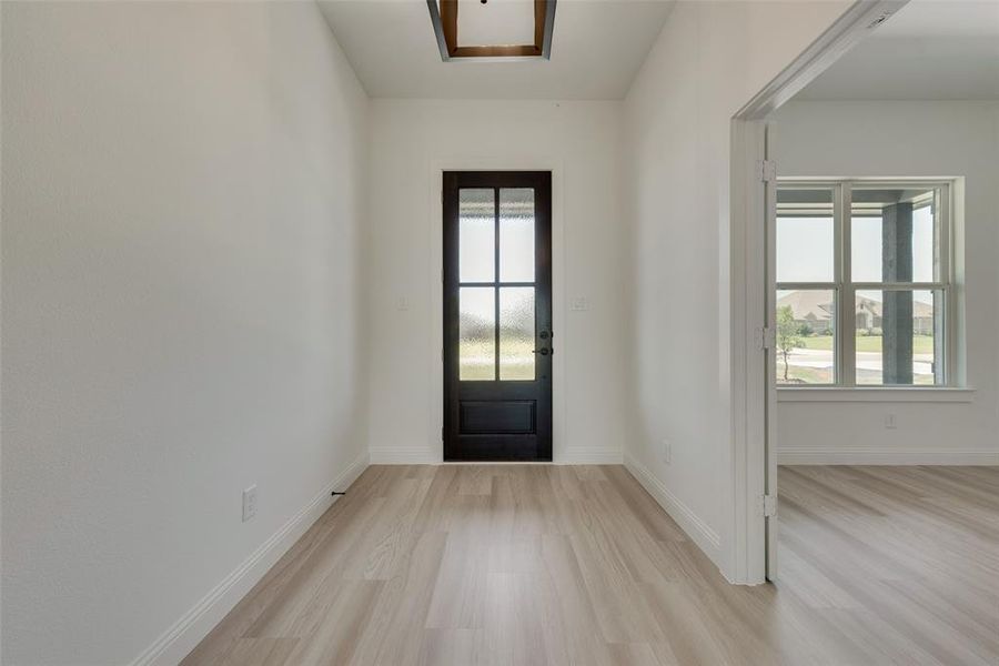 Foyer entrance featuring light wood-type flooring