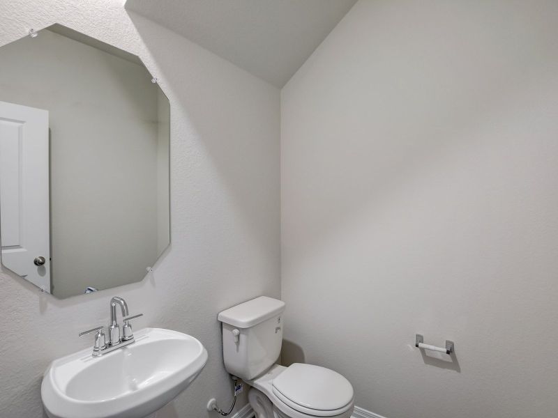 The downstairs half bathroom is great for guests.