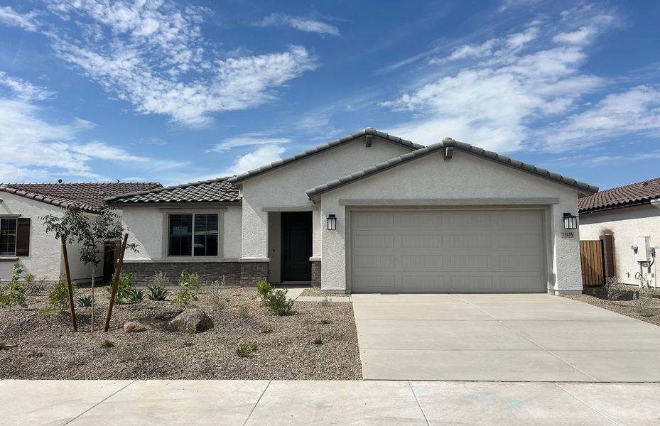 Front exterior of a new home in Alamar, Avondale, AZ, highlighting curb appeal (Image 1). Front exterior of a new home in Alamar, Avondale, AZ, highlighting curb appeal (Image 1).