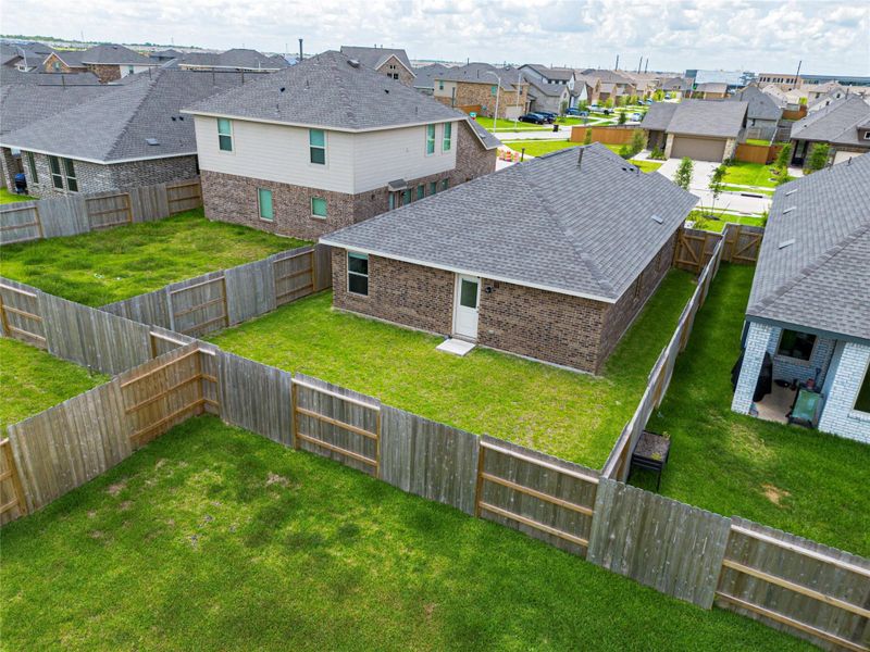 Exterior details and patio area of a home in Sunterra, Katy (Image 22).