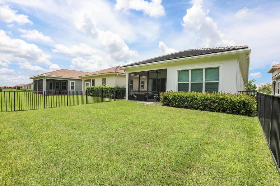 Front exterior of a new home in PGA Village Verano, Port St. Lucie, FL, highlighting curb appeal (Image 27).
