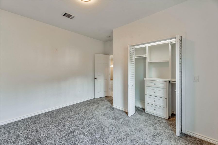 1 OF 3 BEDROOMS,WALK IN CLOSET WITH BUILT IN CABINETS