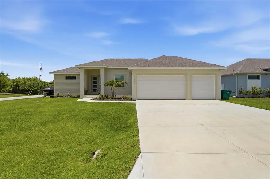 Front exterior of a new home in , Port Charlotte, FL, highlighting curb appeal (Image 2). Front exterior of a new home in , Port Charlotte, FL, highlighting curb appeal (Image 2).