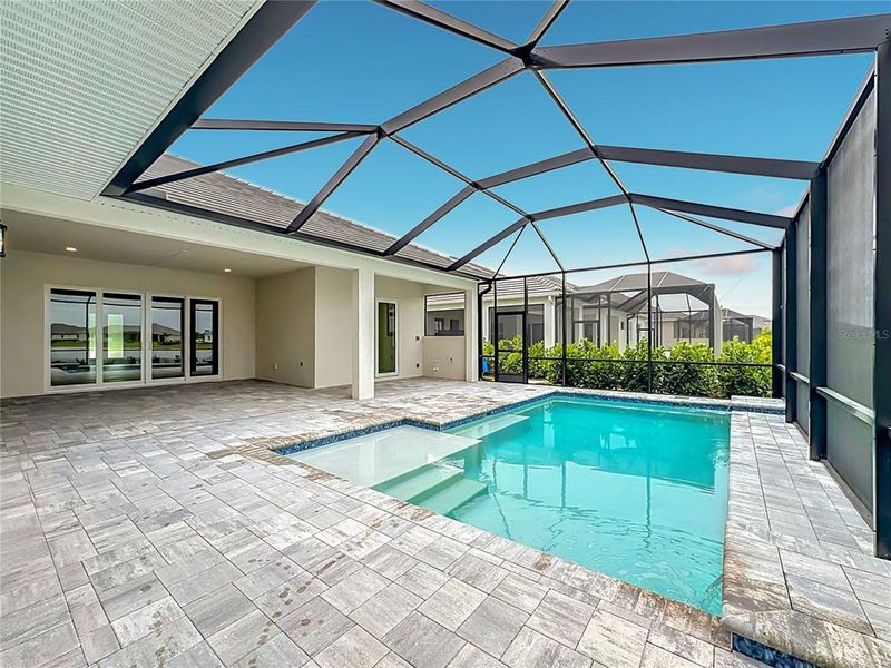 Exterior details and patio area of a home in River Preserve Estates, Parrish (Image 27).