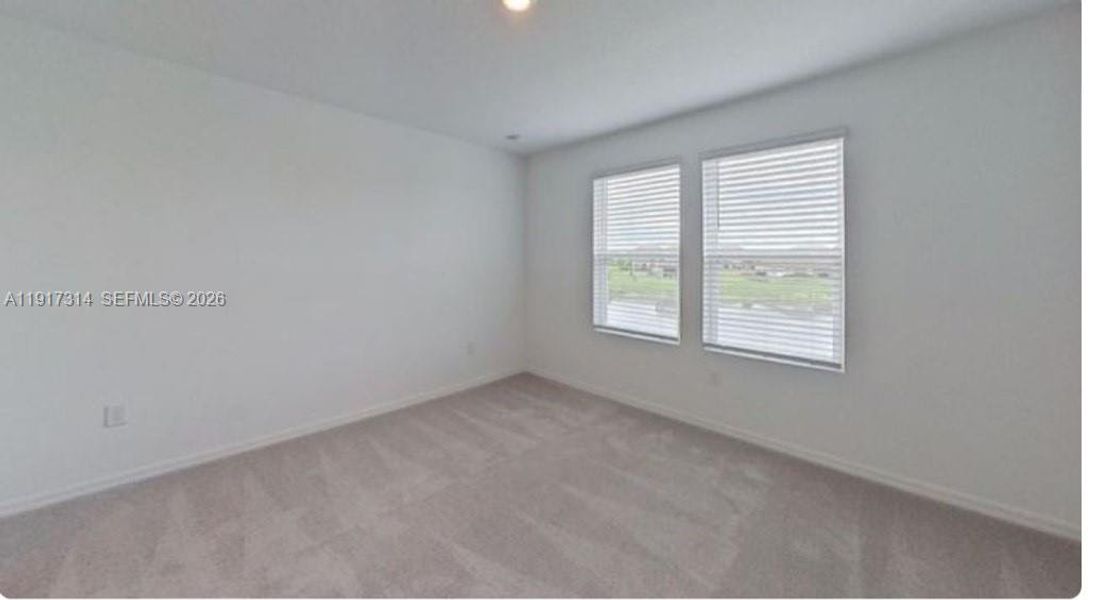 Spacious, unfurnished interior of a new home in The Townhomes at Bellalago, Kissimmee (Image 17).