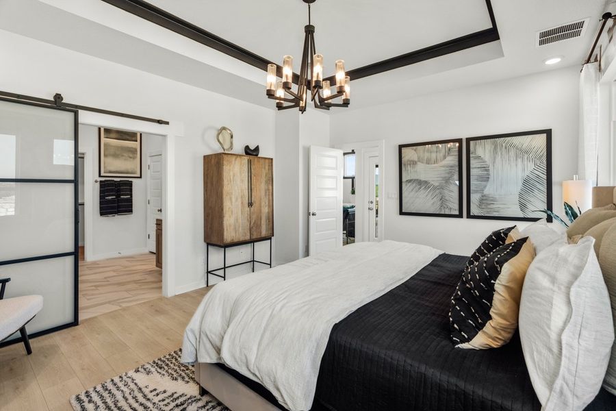 Representative furnished interior of a home built from the Peyton by Chesmar Homes in University Heights, Round Rock (Image 9).