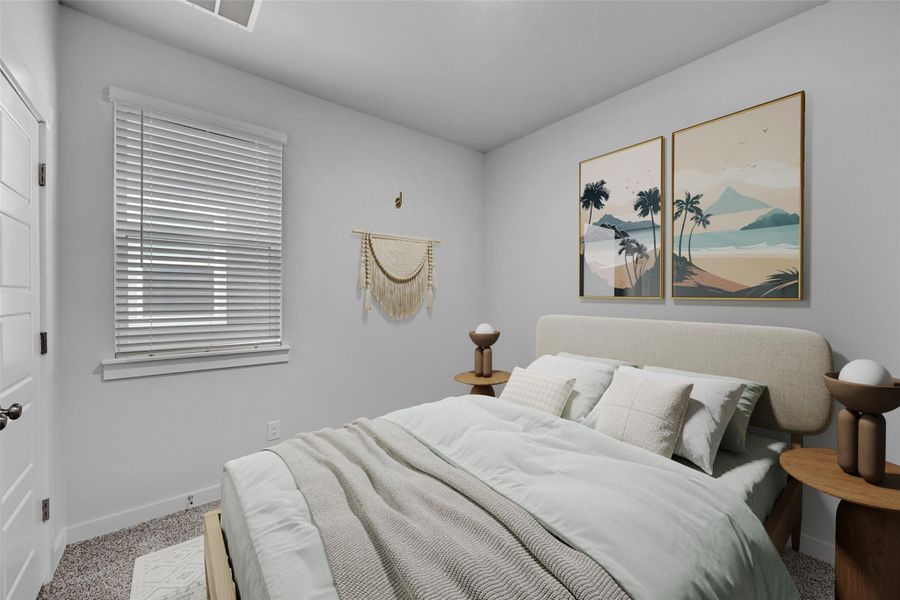 Carpeted bedroom featuring baseboards Carpeted bedroom featuring baseboards