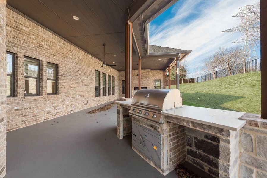 View of patio / terrace featuring grilling area, area for grilling, and ceiling fan