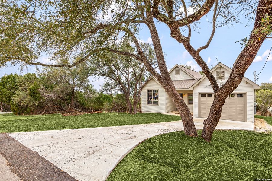 Front exterior of a new home in , Canyon Lake, TX, highlighting curb appeal (Image 30).