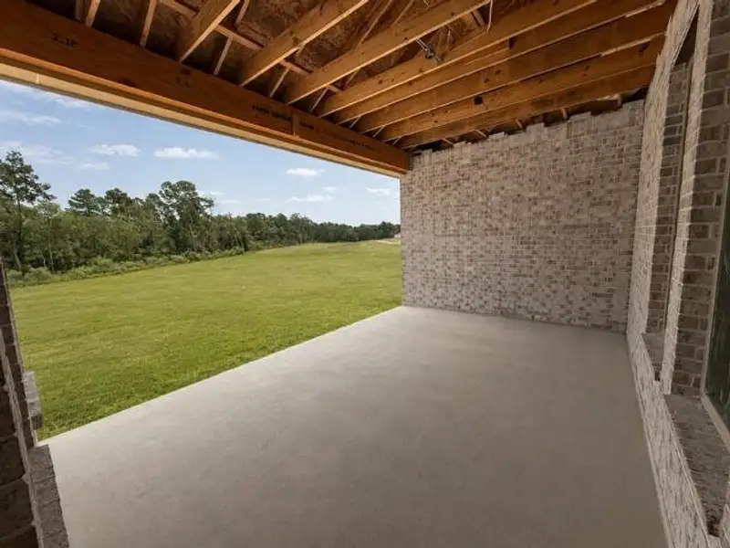 Exterior details and patio area of a home in , Spring (Image 3).