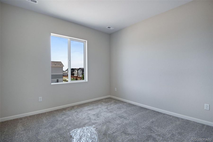 Spacious, unfurnished interior of a new home in Reunion Ridge, Commerce City (Image 18).