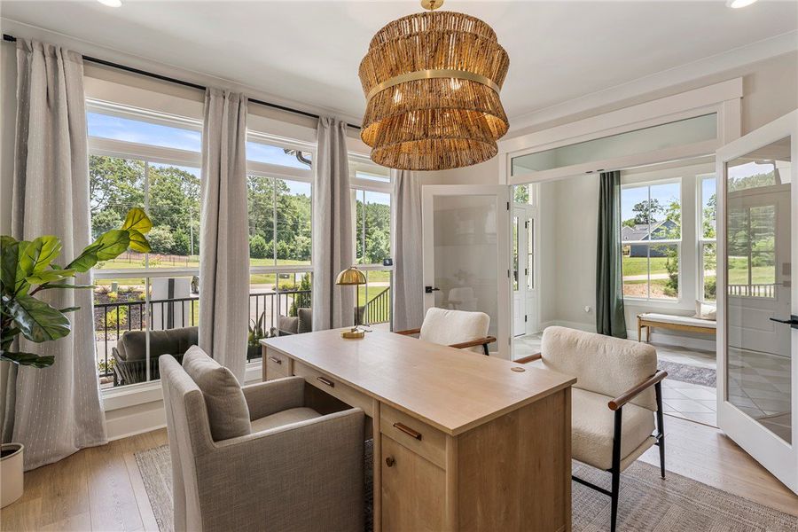 This bright office space features large windows an