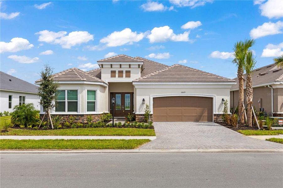Front exterior of a new home in , Sarasota, FL, highlighting curb appeal (Image 2).