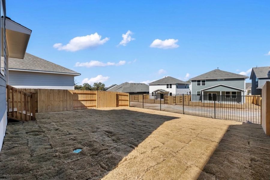 Exterior details and patio area of a home in Cannon Ranch, Dripping Springs (Image 31).