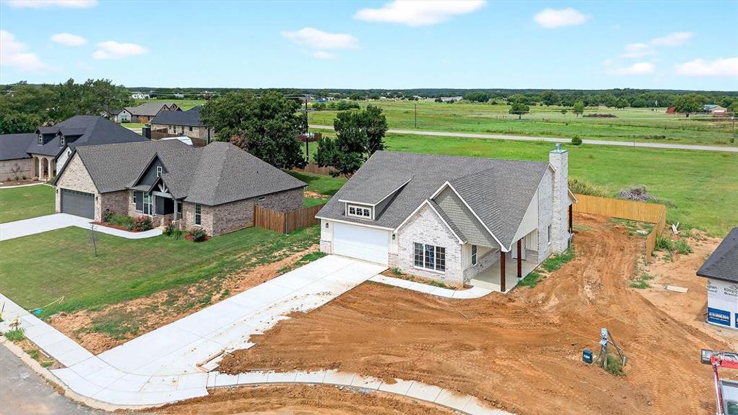 Front exterior of a new home in , Callisburg, TX, highlighting curb appeal (Image 1).