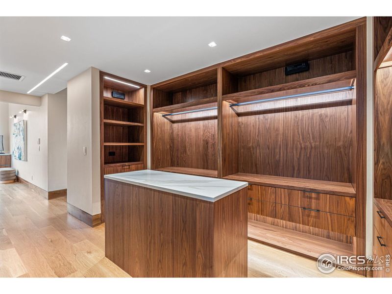 The primary closet: Quartz countertop on the central dresser island.