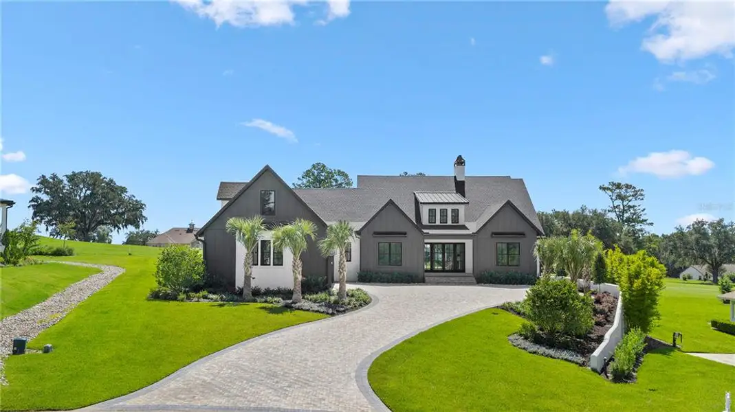 Front exterior of a new home in , Ocala, FL, highlighting curb appeal (Image 32).