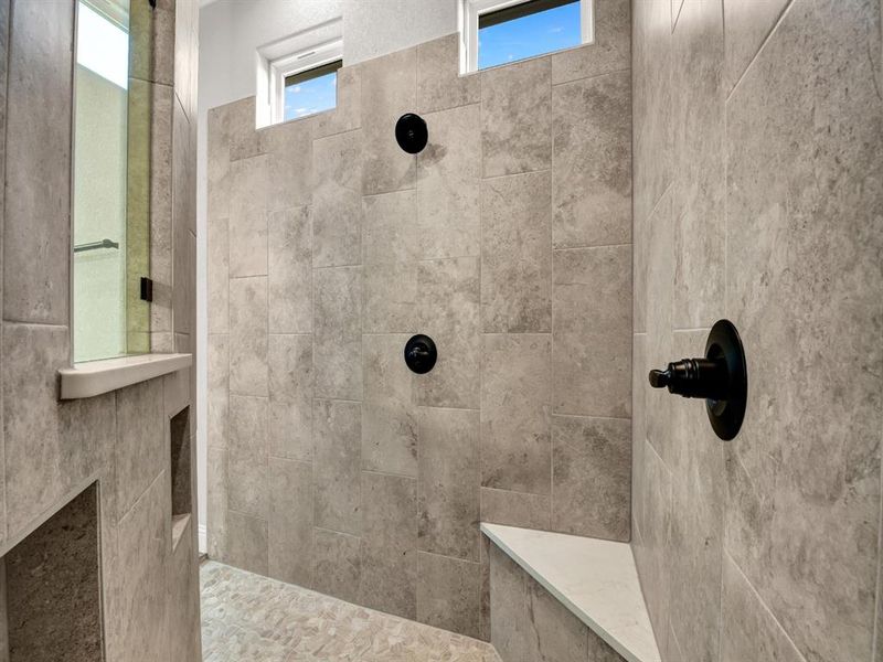 Bathroom featuring tiled shower