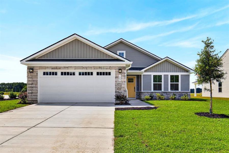 Front exterior of a new home in Beacon Point at New Hampstead, Savannah, GA, highlighting curb appeal (Image 1). Front exterior of a new home in Beacon Point at New Hampstead, Savannah, GA, highlighting curb appeal (Image 1).