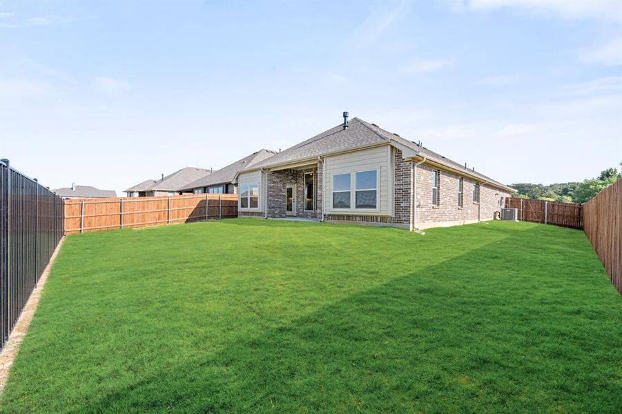 Exterior details and patio area of a home in Parks at Panchasarp Farms 55-60, Burleson (Image 3).