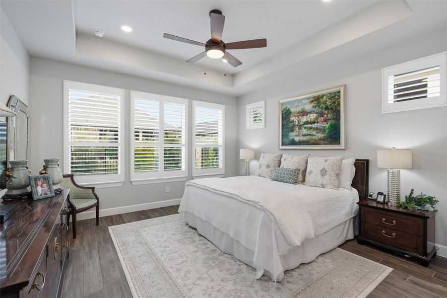 The primary bedroom is at the rear of the home and features a step ceiling, plenty of space, nice windows with views of the backyard. The primary bedroom is at the rear of the home and features a step ceiling, plenty of space, nice windows with views of the backyard.