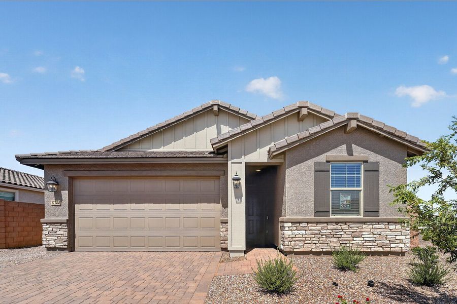 Front exterior of a new home in Combs Ranch, San Tan Valley, AZ, highlighting curb appeal (Image 1). Front exterior of a new home in Combs Ranch, San Tan Valley, AZ, highlighting curb appeal (Image 1).