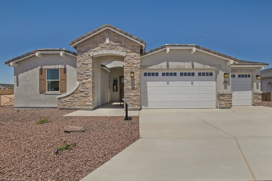 Representative exterior photo of a completed home built from the 2326 by Elliott Homes in Acacia at Santana, Yuma, AZ (Image 26).