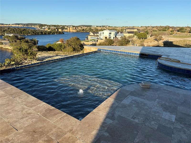 View of swimming pool featuring a water view View of swimming pool featuring a water view
