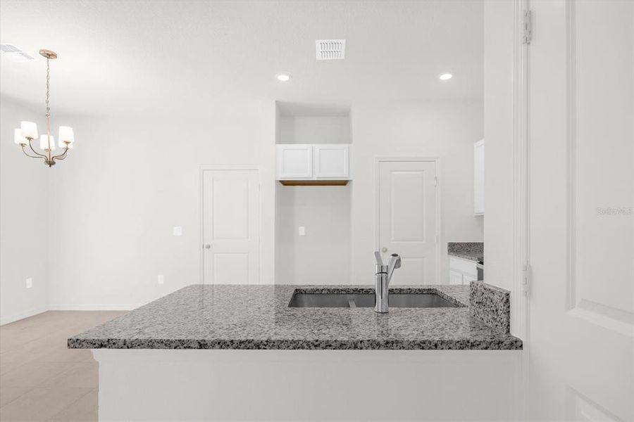 Furnished interior view inside a new home in Bellaviva III at Westside, Davenport (Image 6).