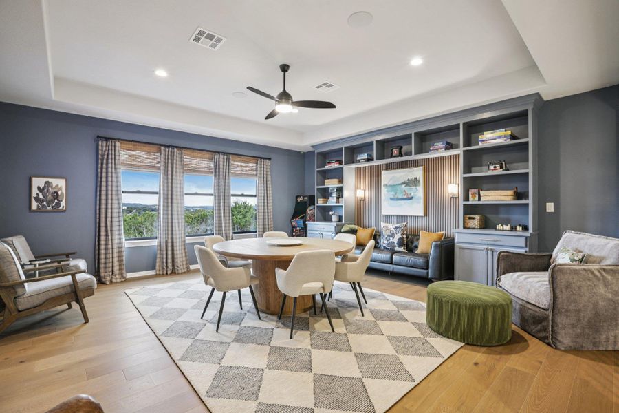 Upstairs, a spacious flex game room provides a second living area for family fun and relaxation.