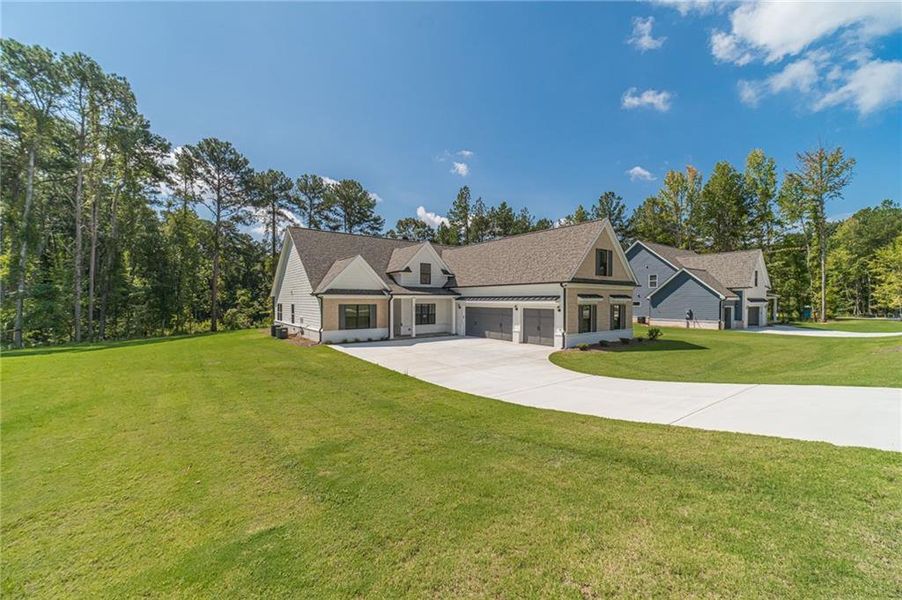 Front exterior of a new home in , Loganville, GA, highlighting curb appeal (Image 2). Front exterior of a new home in , Loganville, GA, highlighting curb appeal (Image 2).
