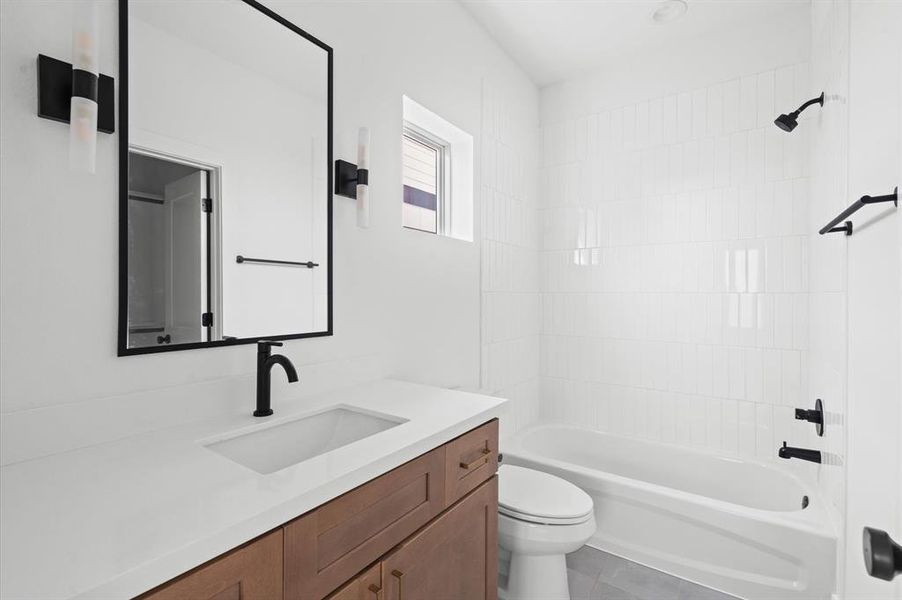 Beautiful finishes with a spacious vanity and full bathtub.