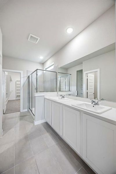 Primary Bathroom in the Willow home plan by Trophy Signature Homes – REPRESENTATIVE PHOTO