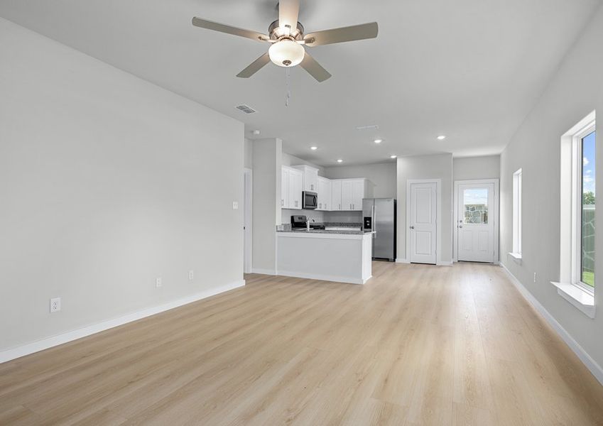 Open floor plan connects a living room and kitchen