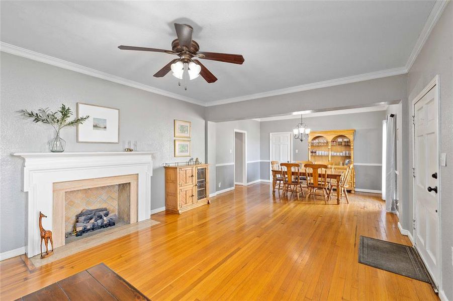 Living room with hardwood floors and gas log fireplace