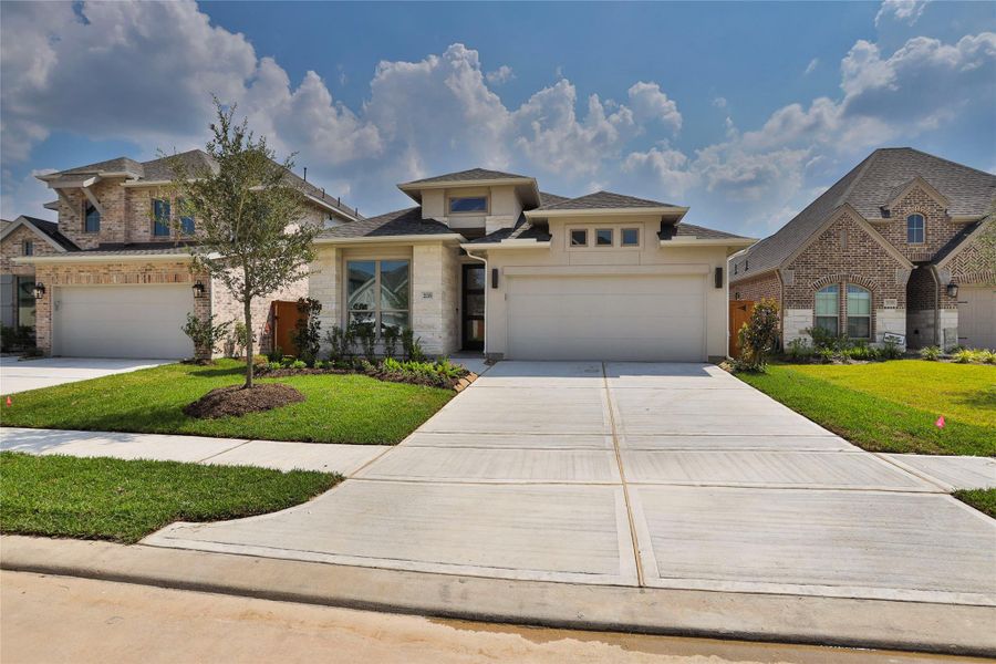 Front exterior of a new home in Marvida 45' - Gated, Cypress, TX, highlighting curb appeal (Image 1). Front exterior of a new home in Marvida 45' - Gated, Cypress, TX, highlighting curb appeal (Image 1).