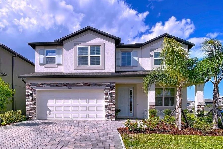 Front exterior of a new home in , Zephyrhills, FL, highlighting curb appeal (Image 24).