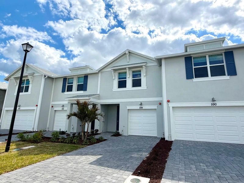 Front exterior of a new home in Tidewater, Fort Pierce, FL, highlighting curb appeal (Image 2). Front exterior of a new home in Tidewater, Fort Pierce, FL, highlighting curb appeal (Image 2).