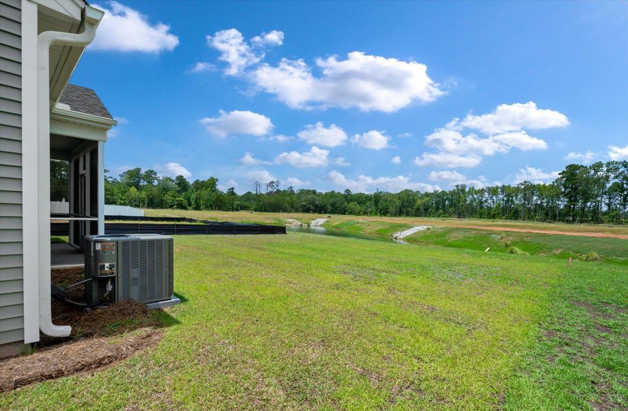Front exterior of a new home in Parker's Preserve, Ridgeville, SC, highlighting curb appeal (Image 22). Front exterior of a new home in Parker's Preserve, Ridgeville, SC, highlighting curb appeal (Image 22).
