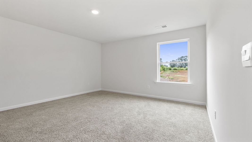 Spacious, unfurnished interior of a new home in Bentley Park, Greenwood (Image 25).
