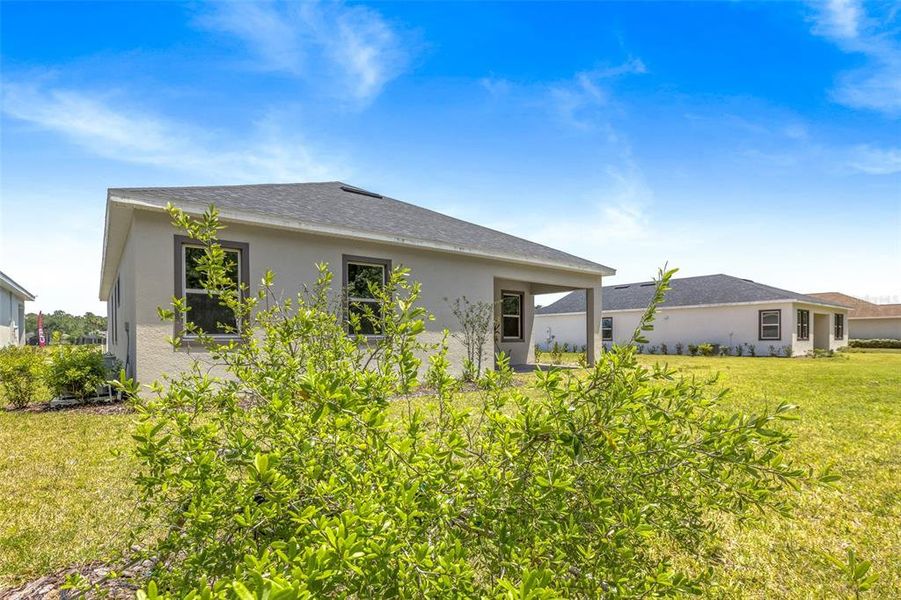 Exterior details and patio area of a home in Gray Hawk at Hole Two, Daytona Beach (Image 27).