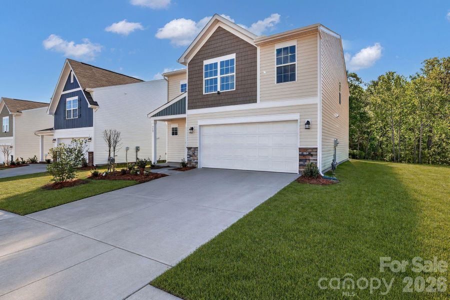 Front exterior of a new home in Cleveland Hill, Shelby, NC, highlighting curb appeal (Image 2). Front exterior of a new home in Cleveland Hill, Shelby, NC, highlighting curb appeal (Image 2).