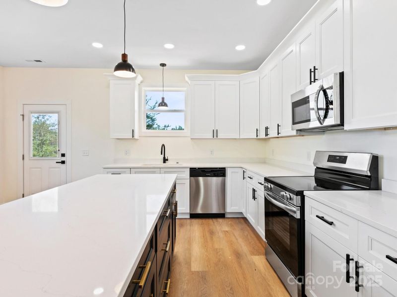 Stainless steel appliances are sleek and easy to clean