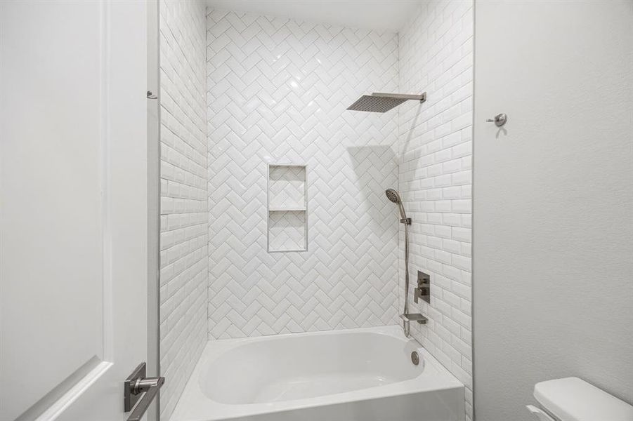 tub and shower in second bathroom