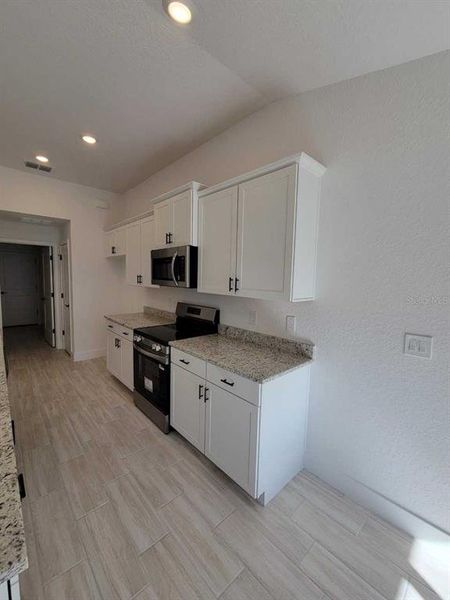 Furnished interior view inside a new home in Ocala Waterway / Kingsland Country Estates, Ocala (Image 8).