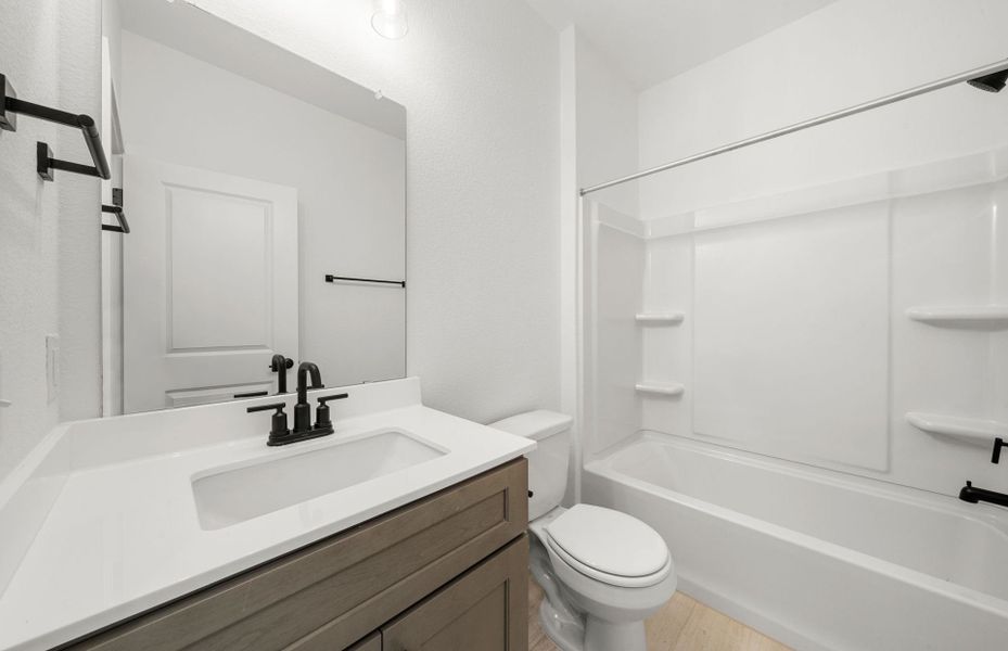 Furnished interior view inside a new home in Crosswinds, Kyle (Image 4).